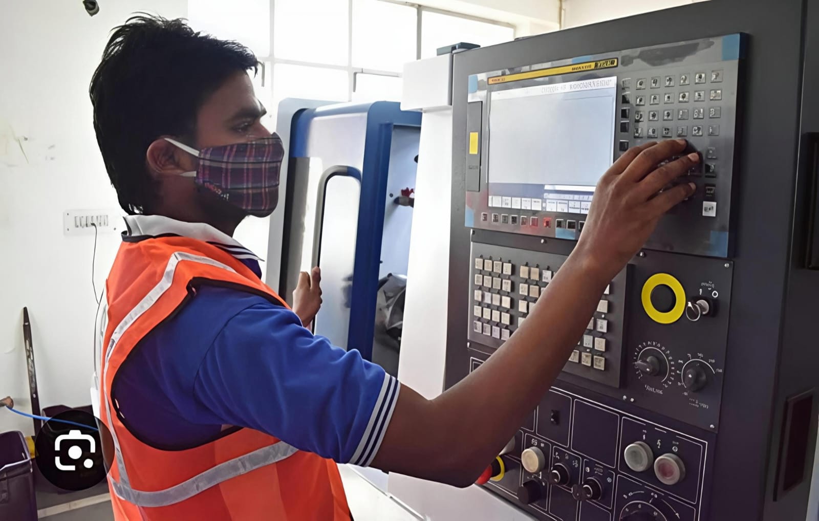 CNC machining specialist programming path setups via interface panel console